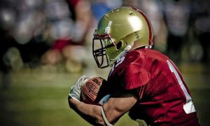 The players wore football gloves and played seriously.