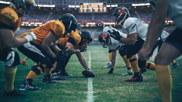 The football players had their football gloves on and were ready to go.